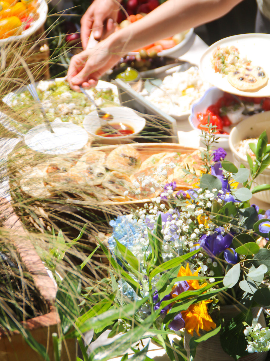 A Pree spring spread — bread, savory pastries, salad, fresh flowers